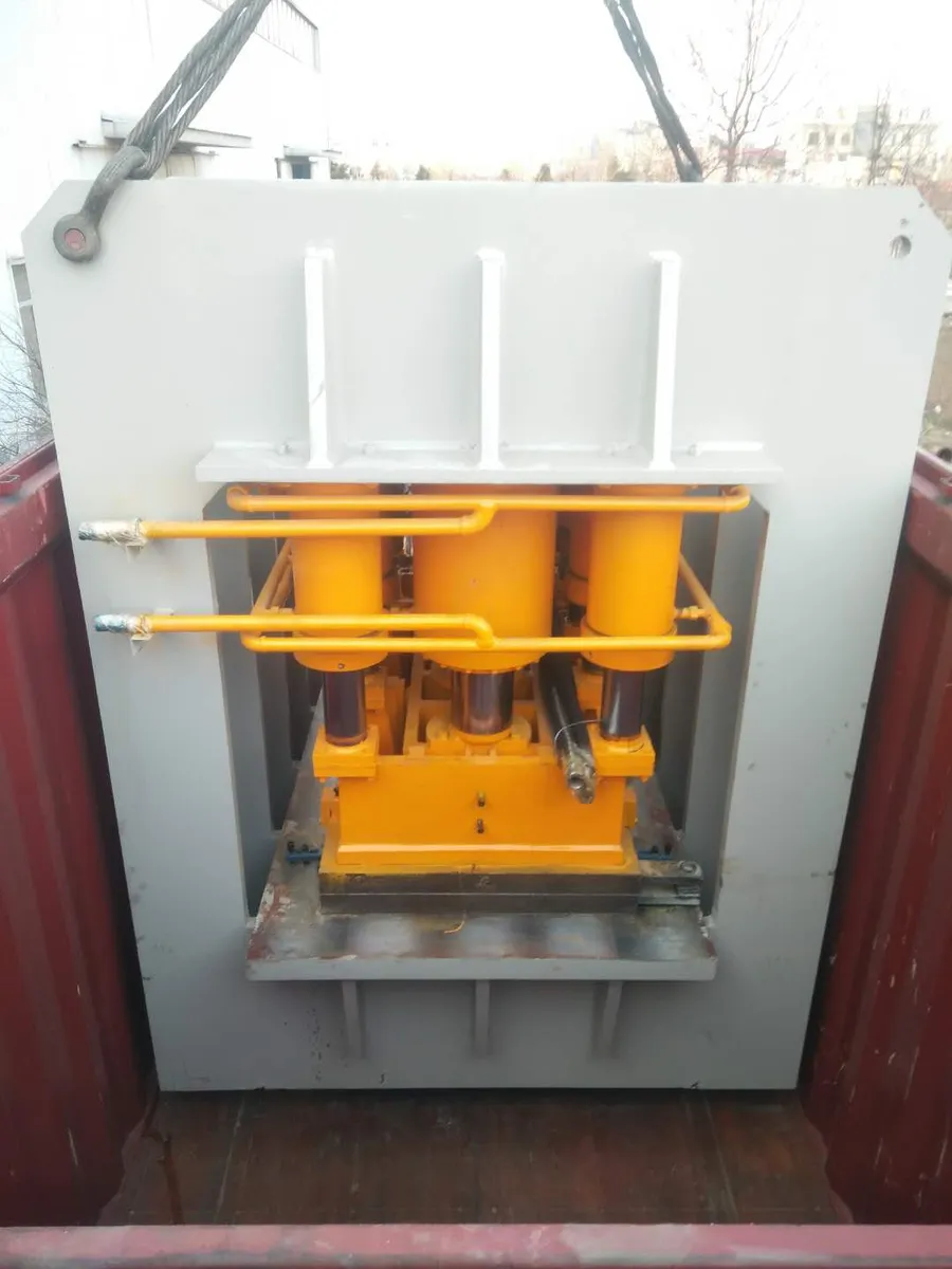 Press frame loaded into a container