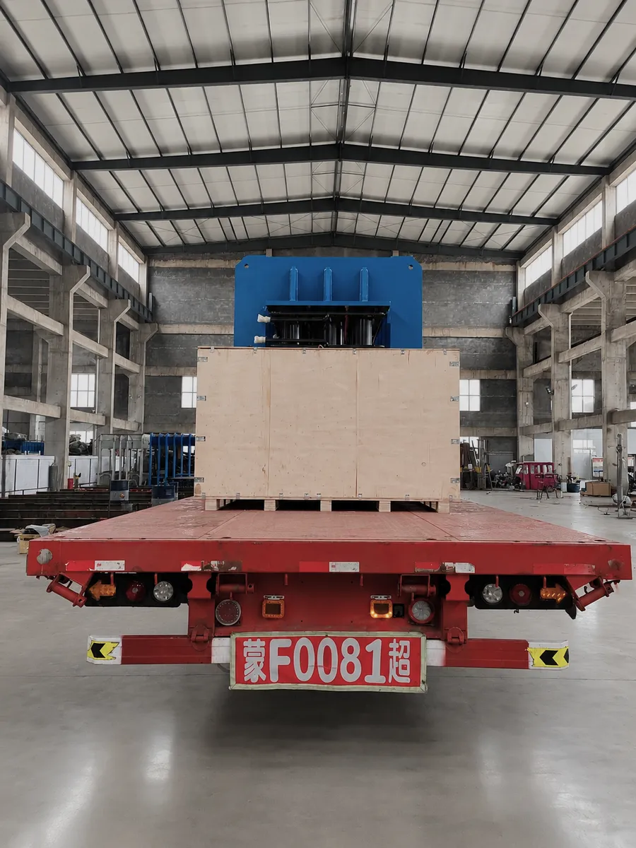 Large press on a flatbed truck inside the factory