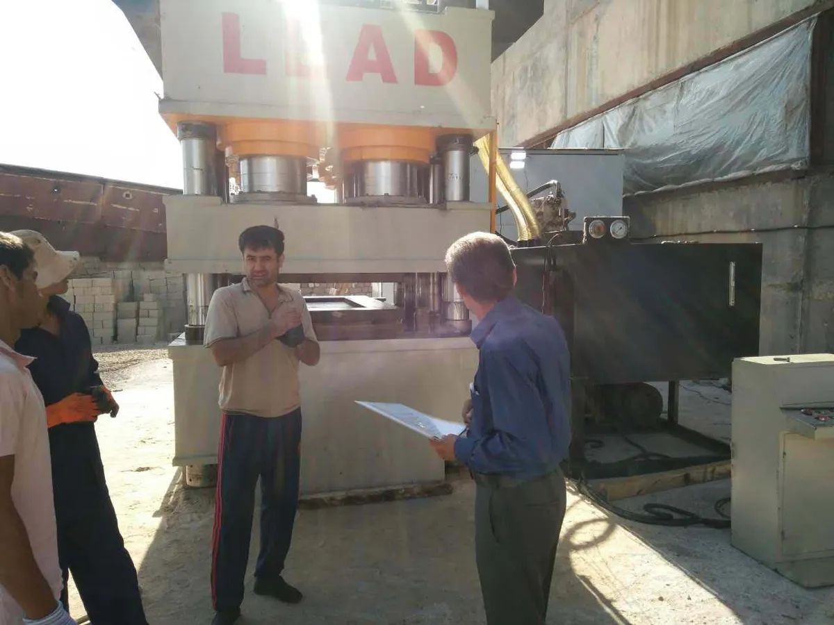 Large LEAD hydraulic press forming metal panels at a customer plant